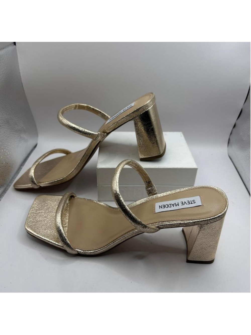 A pair of Steve Madden Lilah gold sandals in size 9